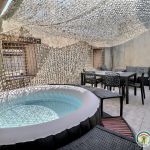 Terrasse sur les toits ombragée avec spa Terrasse sur les toits ombragée avec spa